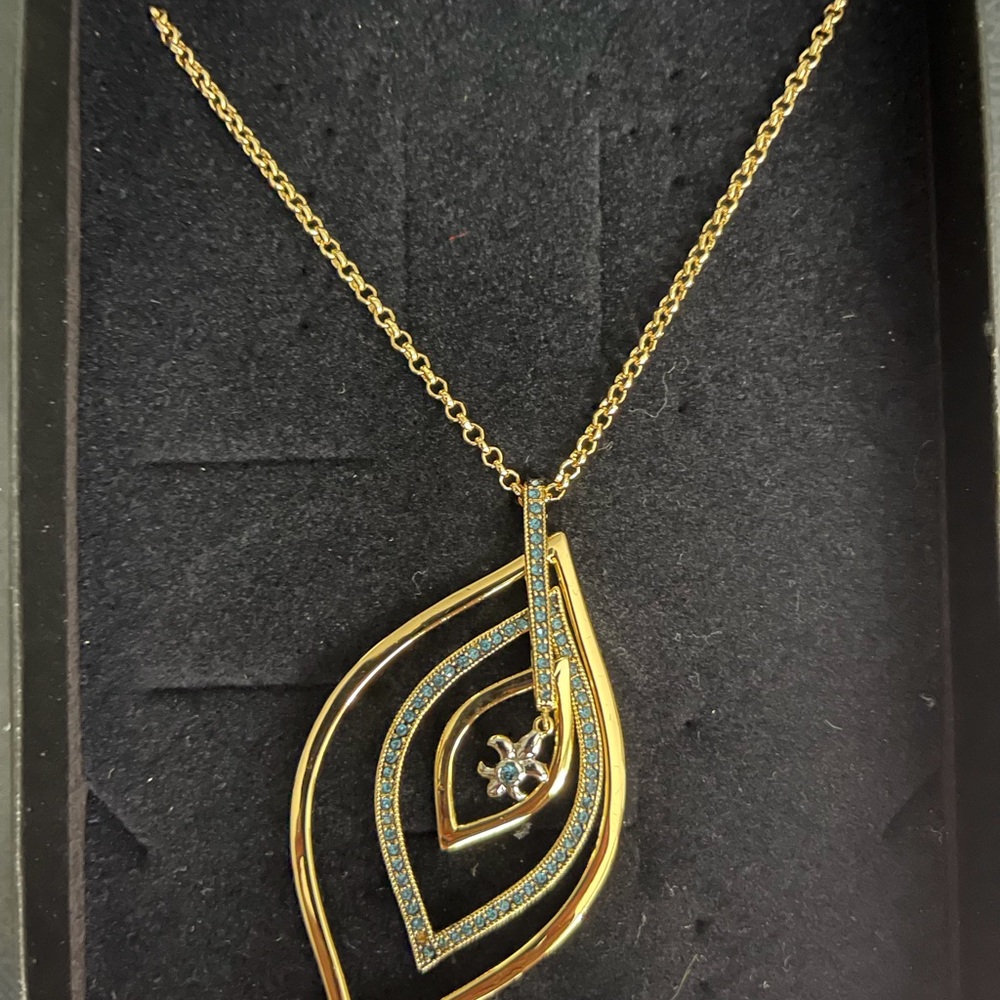 Heidi Daus Gold and Blue Necklace with Artistic Design